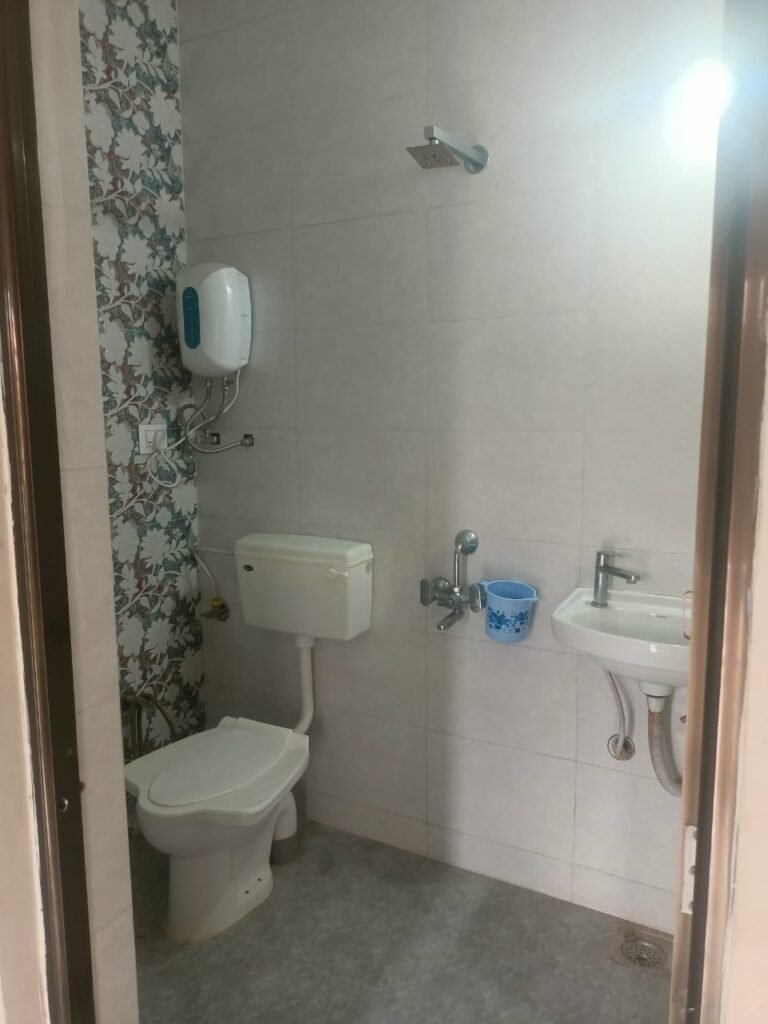 Clean attached bathroom at Shiv Homestay