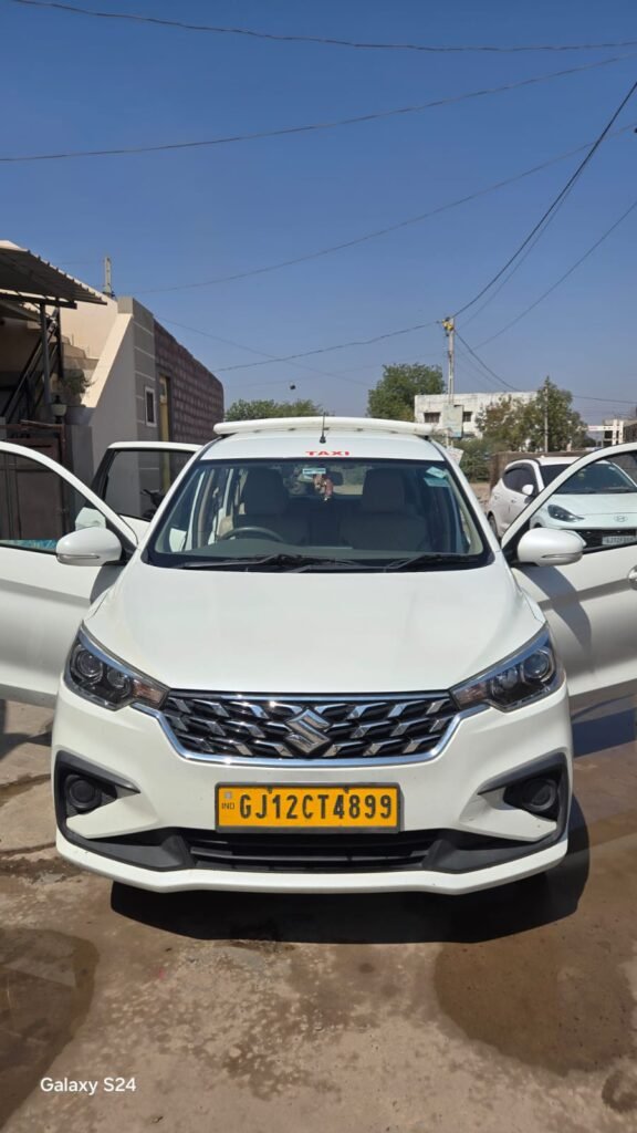 Family-friendly rental car with open doors, Ashapura Tour & Travels
